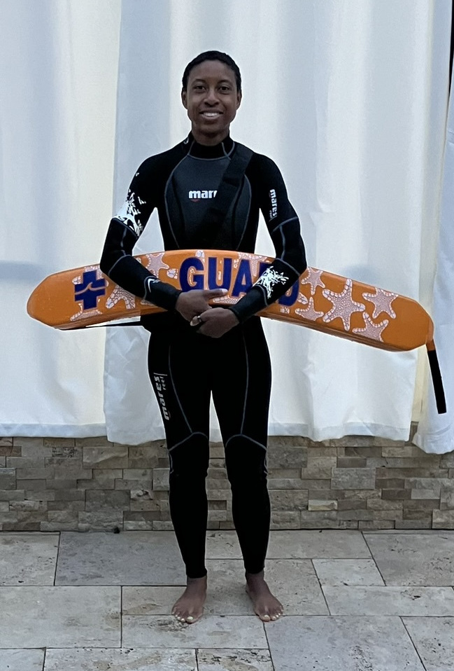 adult learning to swim with instructor